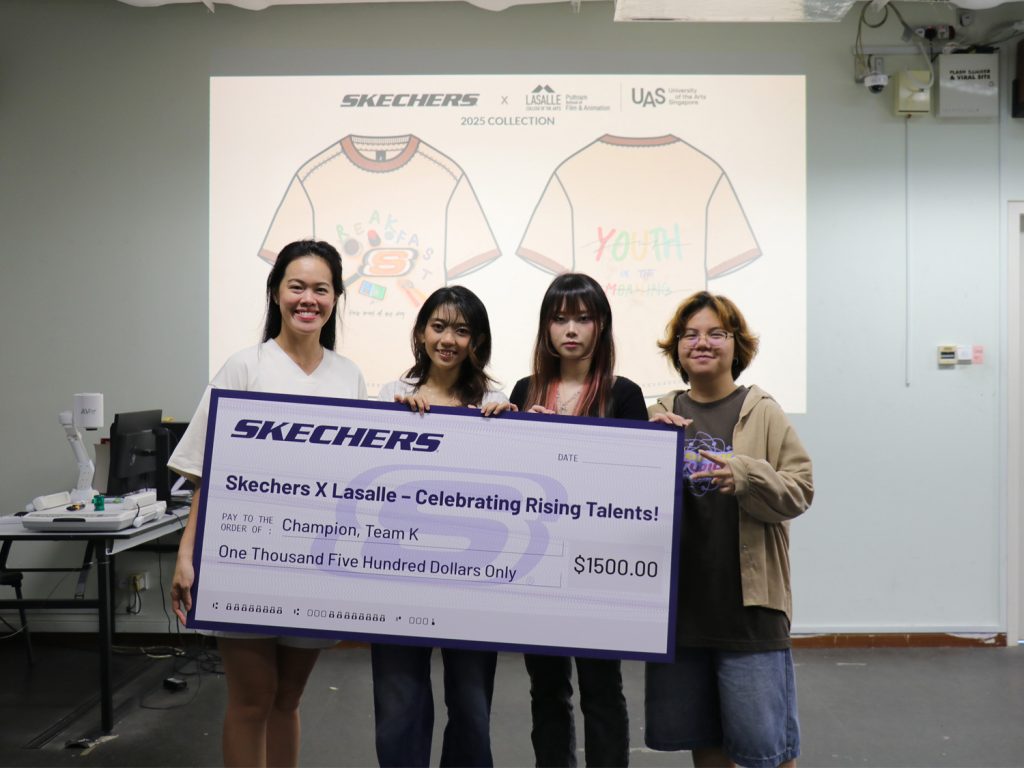 (From left) Serene Wong from Skechers SEA presents a cheque to the winning team of Batrisyia Zulkarnaen, Ashley Adrienne Gunawan and Erika Delgado.